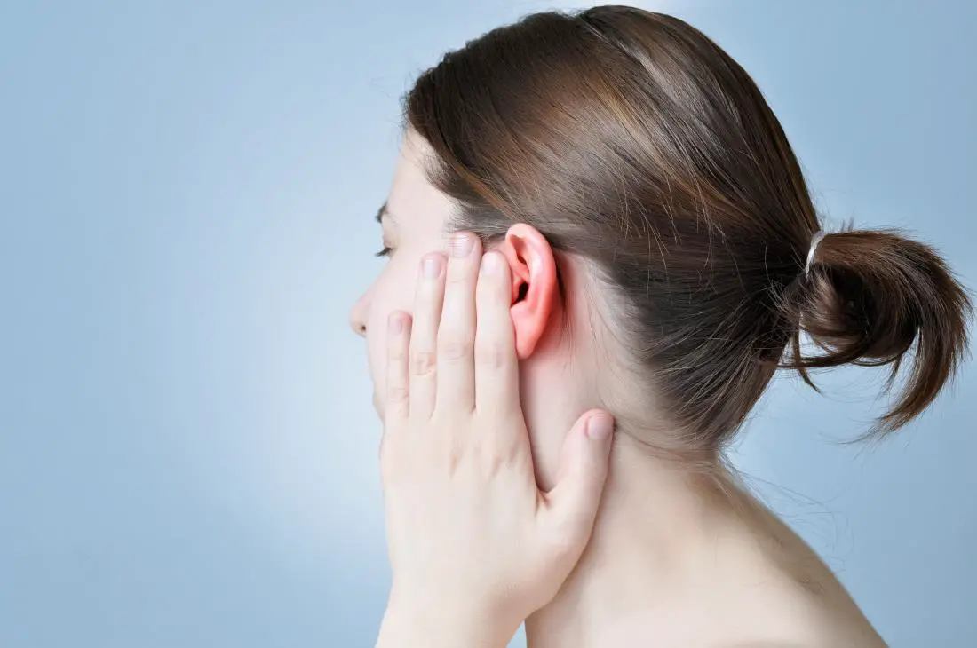 woman-covering-her-ear-in-pain